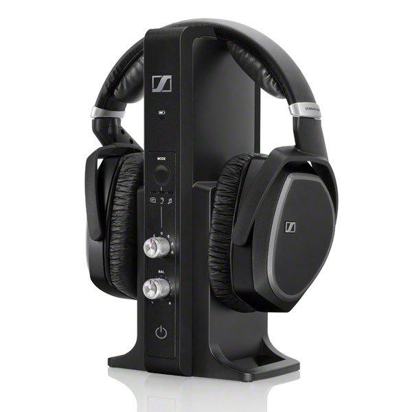 A pair of black wireless Sennheiser RS 195-U over-ear TV headphones with a charging station.